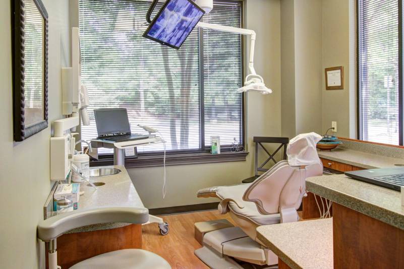 dental work room with dental chair, equipment, and tv